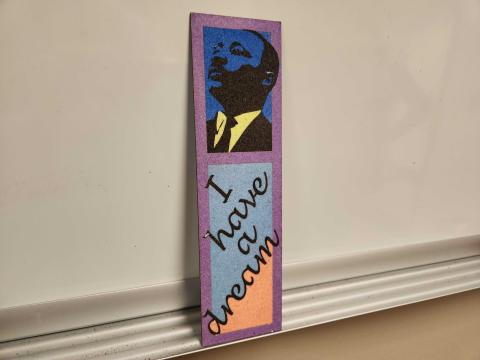Bookmark made from colorful sand with MLK's portrait above the text "I have a dream"