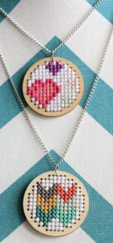 two cross stitched mini necklaces