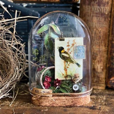 cloche with paper cut outs inside