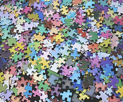 colorful puzzle pieces in a big pile