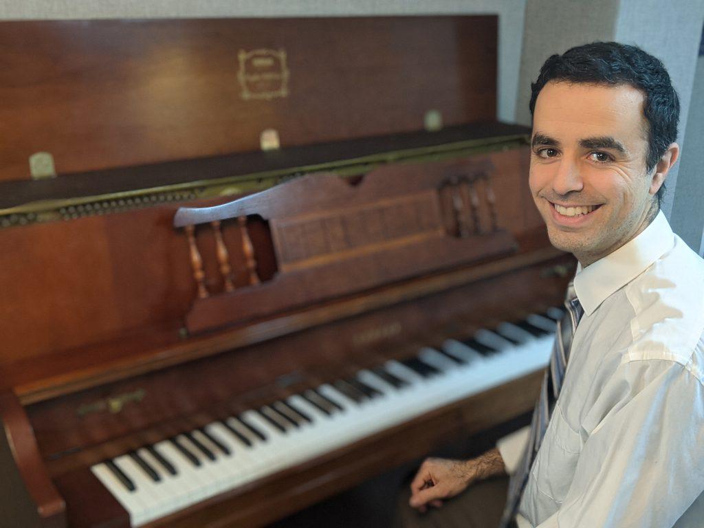 David Rodgers sitting at a piano