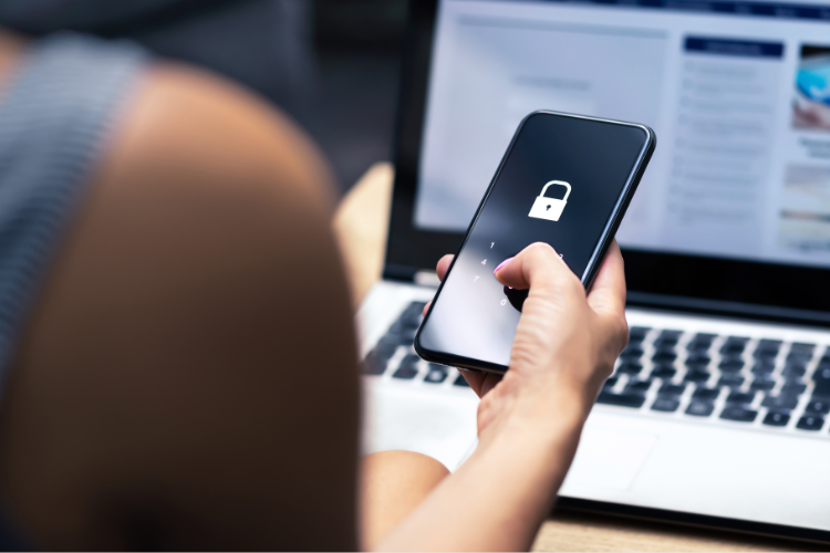 photo of a person holding a phone with a lock icon on it