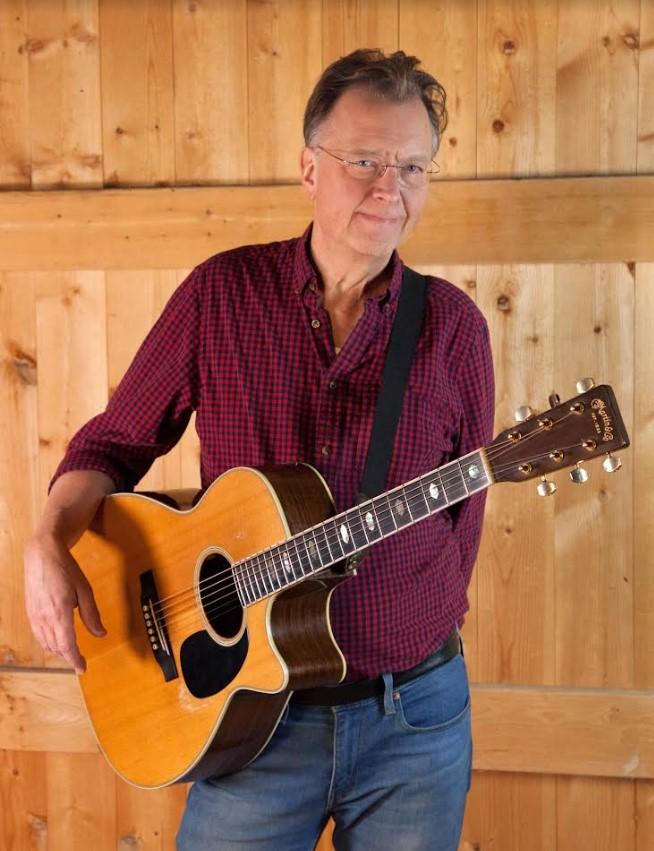 Image of musician Jim Bizer with a guitar